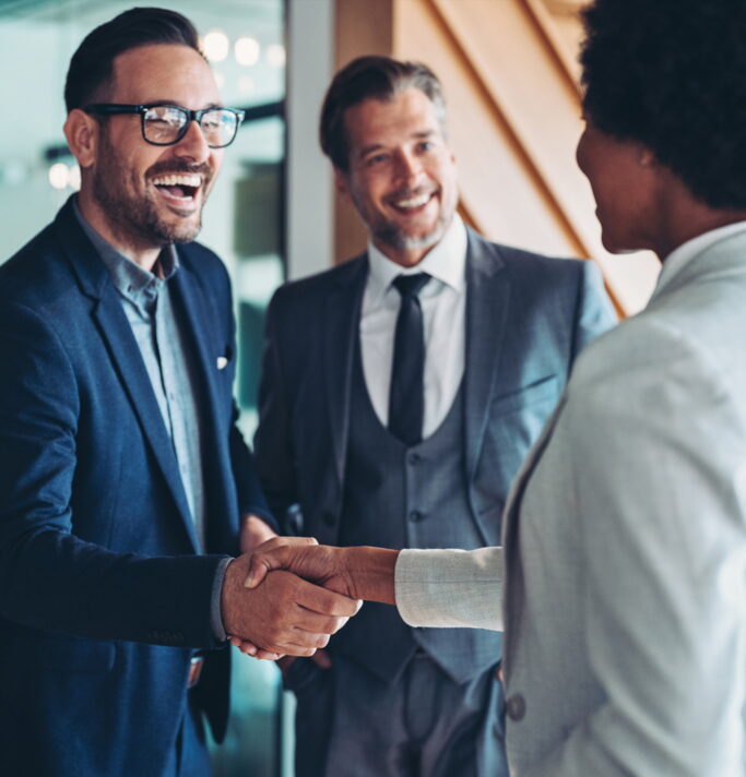 Business professionals shaking hands
